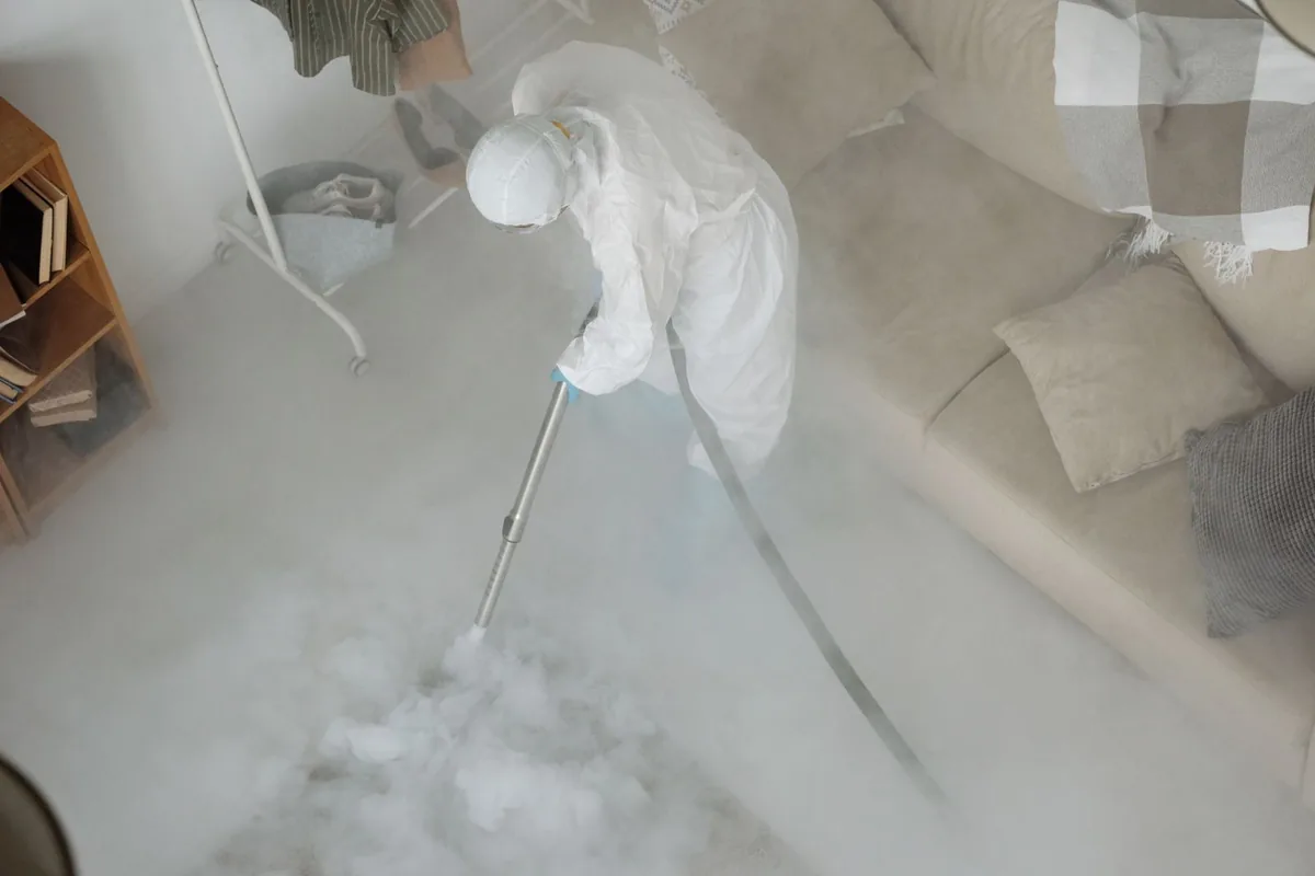 Biohazard cleanup technician in protective equipment, DeSales University, PA